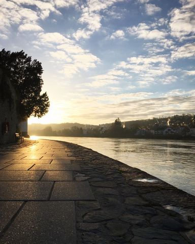 Scenic beach promenade at sunrise with clear sky