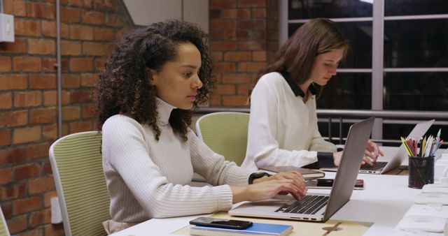 Diverse Women Working on Laptops in Modern Office - Download Free Stock Images Pikwizard.com