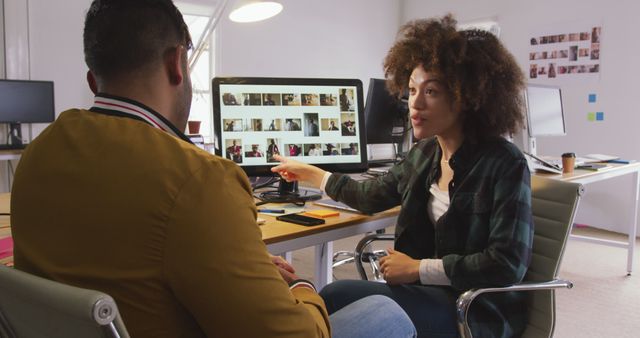 Creative Team Collaborating on Photographic Project in Modern Office - Download Free Stock Photos Pikwizard.com