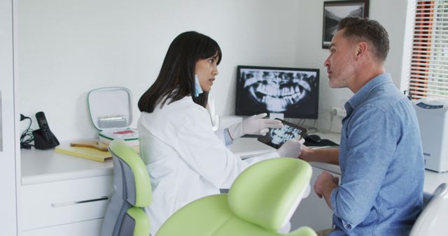 Use this image to illustrate dental consultations, health seminars, or patient care guides. Perfect for websites about dental clinics, healthcare services, patient-doctor interactions, and medical advice content.