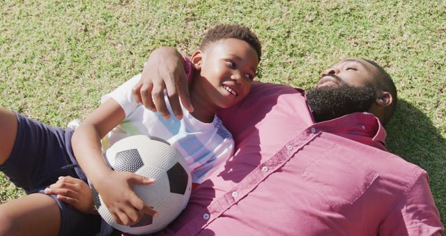 Father and Son Bonding on Grass with Soccer Ball - Download Free Stock Images Pikwizard.com