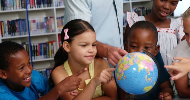 Diverse Group of Kids Learning Geography with Globe in Library - Download Free Stock Images Pikwizard.com