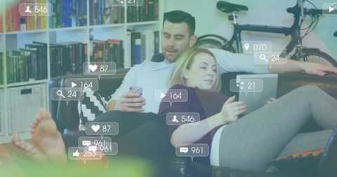 Couple Engaging with Technology in Modern Living Room Setting