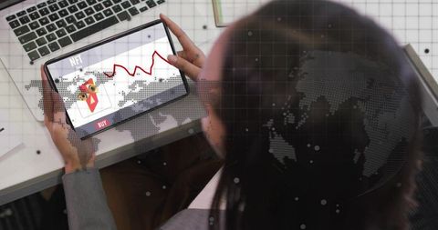 Businesswoman holding tablet viewing NFT market analytics at modern office workspace