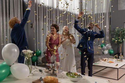 Joyful Celebration with Falling Gold Confetti