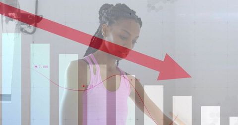 Woman stretching in fitness studio with red arrow and falling performance chart overlay