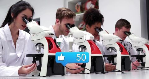 College students conducting microscopy lab work with social media likes overlay