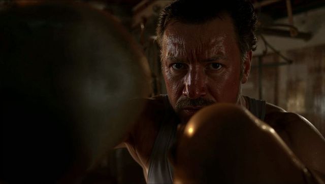 Intense boxer training in vintage gym setting