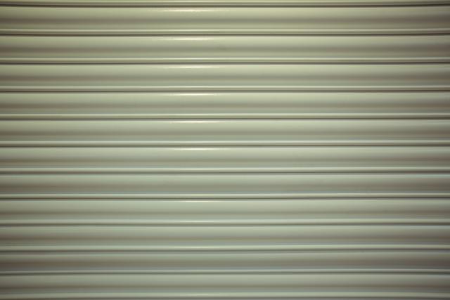 Close-up detail of closed metal security shutter, full frame