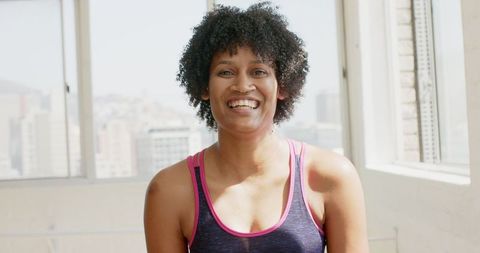 Smiling Woman in Sportswear Enjoying Fitness Session