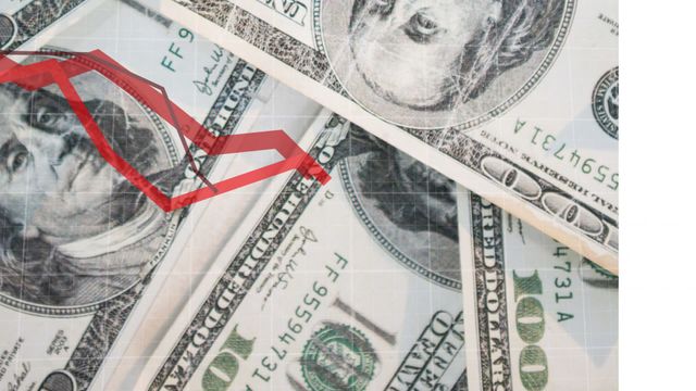 Depiction of a financial downtrend using a graph overlay on US dollar notes. Suitable for illustrating concepts related to economic decline, market downturns, and financial crises. Useful for presentations, financial reports, and articles on market analysis or economic topics.