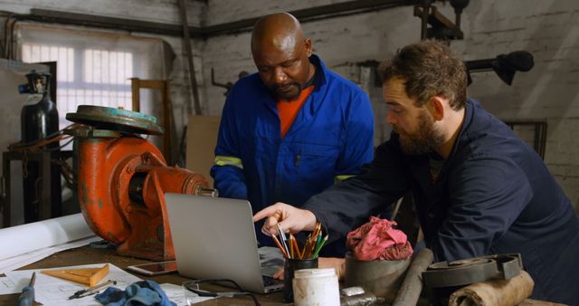 Engineers Collaborating in Industrial Workshop - Download Free Stock Images Pikwizard.com