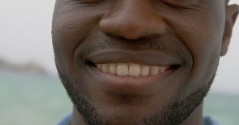 Close-Up of Smiling African American Man at Beach