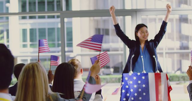 Asian Female Politician Inspiring Supporters at Patriotic Rally - Download Free Stock Images Pikwizard.com