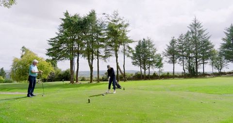 Senior Couple Enjoying Golf Together on Scenic Course