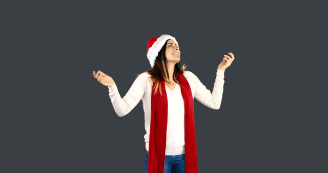 Excited Young Woman Wearing Santa Hat and Celebrating Christmas - Download Free Stock Images Pikwizard.com