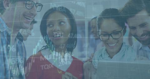 Diverse Team Analyzing Financial Market Trends on Laptop