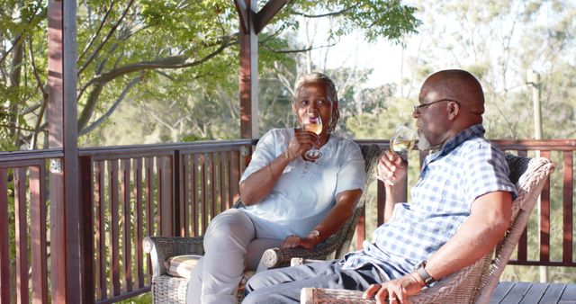 Senior Couple Enjoying Wine on Balcony with Scenic Forest View - Download Free Stock Images Pikwizard.com