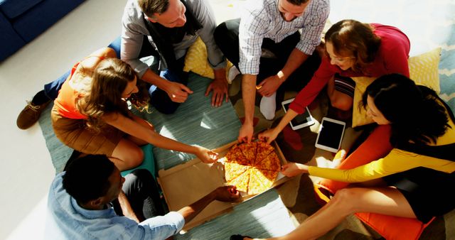 Diverse Group of Friends Sharing Pizza in Living Room - Download Free Stock Images Pikwizard.com
