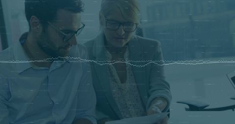 Diverse Colleagues Analyzing Data with Digital Overlay in Office