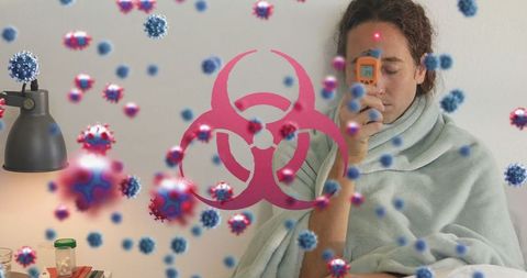 Woman at home checking temperature during pandemic