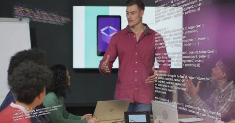 Team Collaborating on Digital App Project at Office Meeting