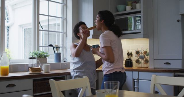 Mother and Daughter Enjoying Breakfast Together in Bright Kitchen - Download Free Stock Images Pikwizard.com