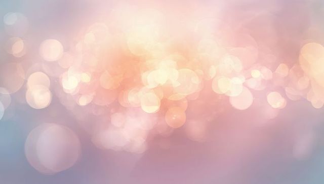 Glowing pastel bokeh lights creating dreamy glow with soft lens flares and iridescent orbs