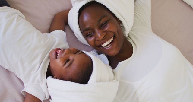 Happy African American Mother and Child with Towel Wrapped Hair - Download Free Stock Images Pikwizard.com