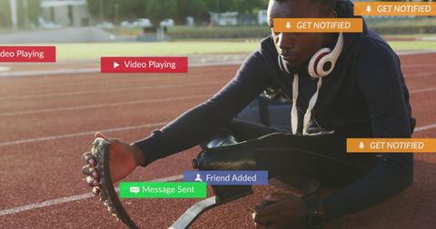 Disabled Athlete Engaged with Social Media Notifications at Track