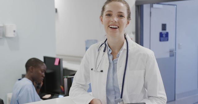 Smiling Female Doctor at Reception Desk in Hospital - Download Free Stock Images Pikwizard.com