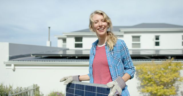 Smiling Woman Installing Solar Panels in Suburban Home - Download Free Stock Images Pikwizard.com