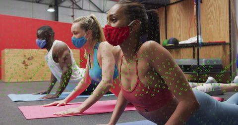 Diverse group exercising with face masks and data overlay