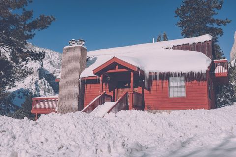 Cozy Red Cabin in Snowy Winter Forest