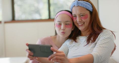 Mother and Daughter Enjoying Skincare Selfie Bonding Moment