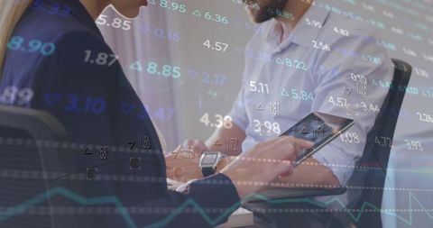 Professionals reviewing financial data on tablet with smartwatch and stock market overlay