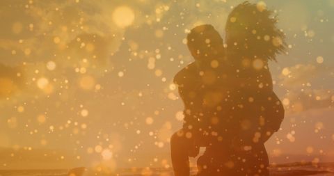 Silhouette of Couple Enjoying Romantic Beach Piggyback Ride