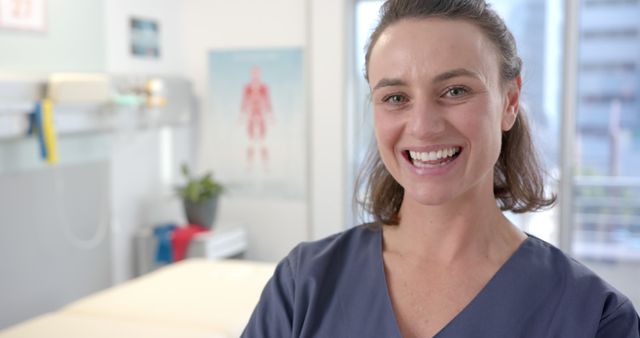 Smiling Female Nurse in Hospital Room Wearing Blue Scrubs - Download Free Stock Images Pikwizard.com