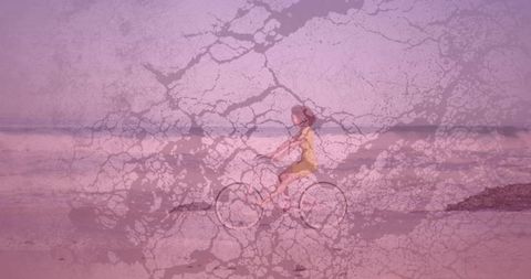 Vintage pink seaside bicycle ride with woman in yellow dress and cracked texture overlay