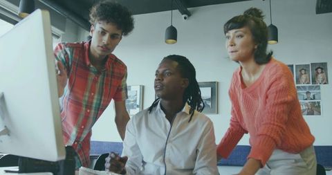 Collaborative Colleagues Engaged in Brainstorming Session with Technology