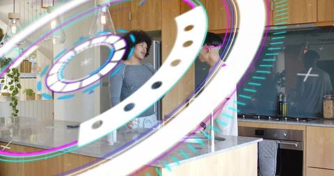 Two men conversing in modern kitchen with futuristic ar holographic rings overlay
