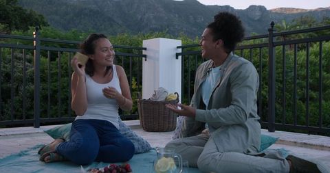 Couple Enjoys Romantic Outdoor Picnic with Refreshments and Scenery