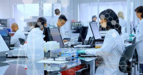 Innovative scientists analyzing data in advanced laboratory