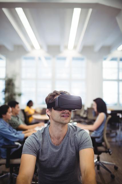 Man using virtual reality headset in the office