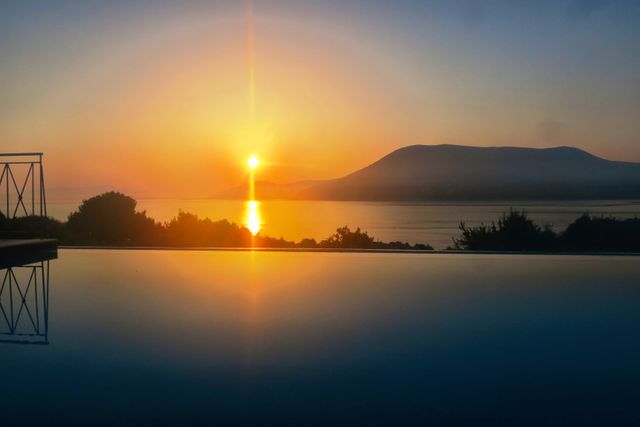 Stunning Sunset over Mountain Reflected in Pool - Download Free Stock Photos Pikwizard.com