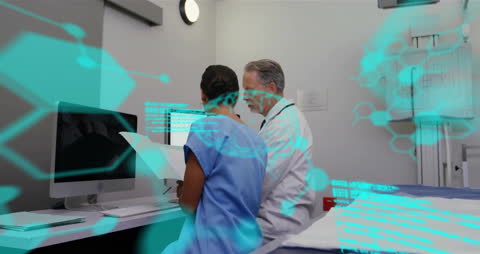 Healthcare Professionals Analyzing Digital Medical Data in Modern Facility