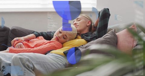 Couple Using Financial Technology While Relaxing at Home