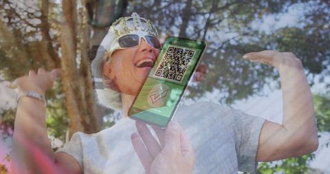 Elderly woman celebrating with covid vaccine passport