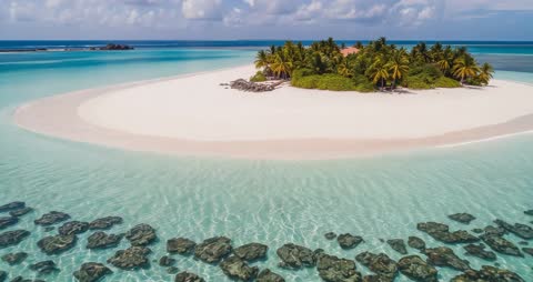 Drone Exploring Tropical Island Paradise Over Crystal Water
