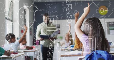 Engaged schoolchildren in classroom with chemistry graphic overlay